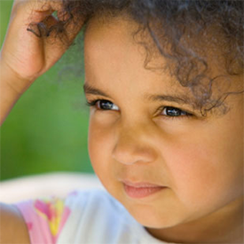 girl scratching her head, facts on head lice